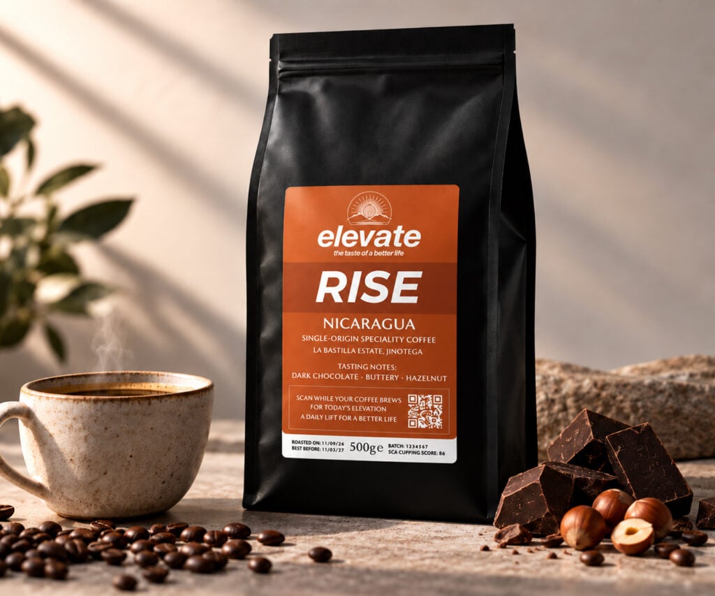 Elevate RISE Nicaraguan specialty coffee with dark chocolate, butter and hazelnut tasting notes beside a freshly brewed coffee.